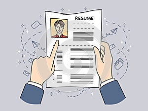 Businessman reading candidate CV