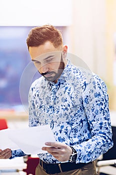 Businessman reading documents in his office