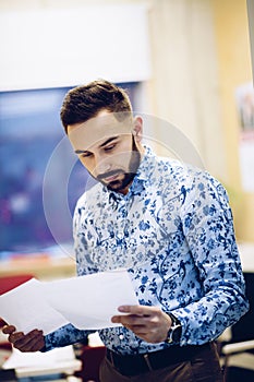 Businessman reading documents in his office