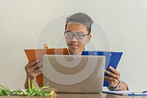 Businessman reading financial document in the office