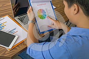 Businessman reading financial reports in the office