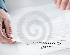 Businessman reading through a legal contract