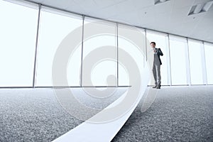 Businessman reading long paper list