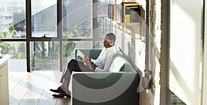 Businessman Reading Magazine Relaxation Concept