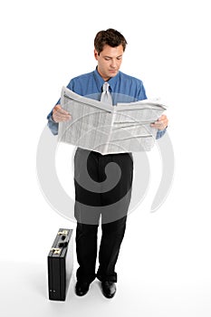 Businessman reading newspaper