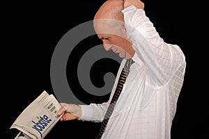 Businessman reading newspaper