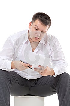 Businessman reading a report with scepticism