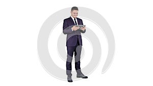 Businessman Reading or Working on a digital tablet on white background.