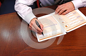 Businessman reads financial report 1