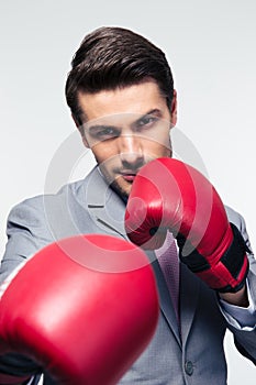 Businessman ready to fight with boxing gloves