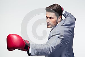 Businessman ready to fight with boxing gloves