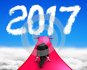 Businessman ready to run on arrow going toward 2017 cloud