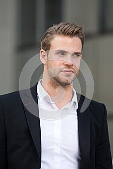Businessman ready to solve pronlems. Man well groomed elegant formal suit walk urban background. Businessman handsome