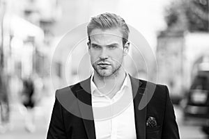 Businessman ready to solve pronlems. Man well groomed elegant formal suit walks urban background. Businessman serious