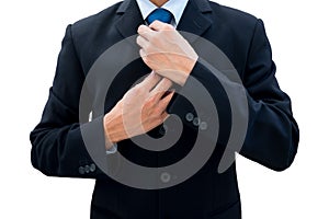 Businessman rearrange his neck tie photo