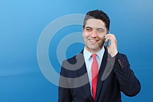 Businessman receiving encouraging news on the phone