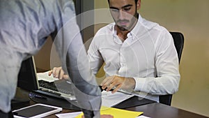 Businessman receiving file with documents