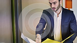 Businessman receiving file with documents