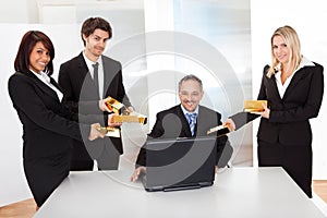 Businessman receiving gold bars