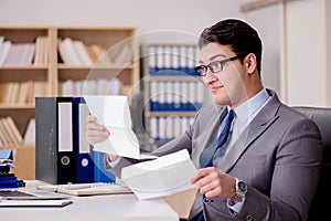 The businessman receiving letter envelope in office