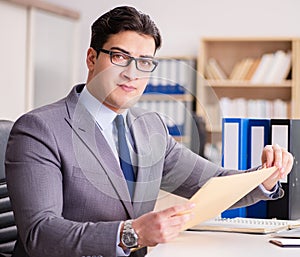 Businessman receiving letter in the office