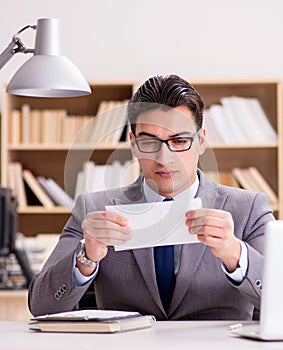 Businessman receiving letter in the office