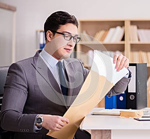 Businessman receiving letter in the office