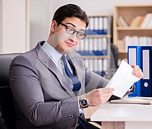 Businessman receiving letter in the office