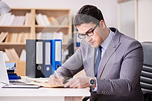 The businessman receiving letter in the office