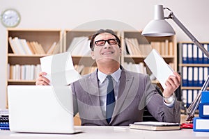 The businessman receiving letter in the office