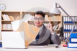 The businessman receiving letter in the office