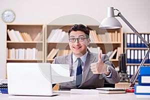 The businessman receiving letter in the office