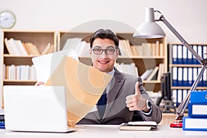 The businessman receiving letter in the office