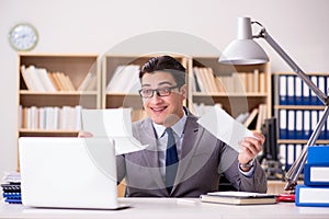 The businessman receiving letter in the office