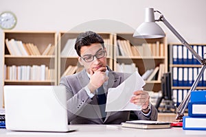 The businessman receiving letter in the office