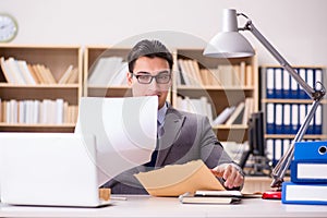 The businessman receiving letter in the office