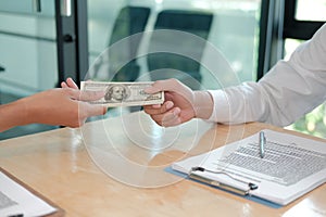 Businessman receiving money. woman giving cash banknote to man. bribery, corruption, venality concept