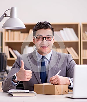 Businessman receiving parcel in the office