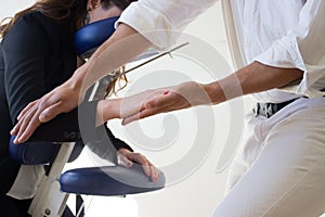 Businessman receiving shiatsu on a massage chair