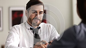 Businessman recruiter listen candidate at job interview in office.