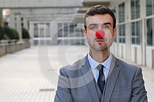 Businessman with a red clown nose