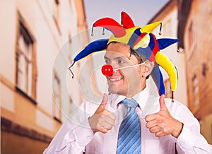 Businessman with a red clown nose