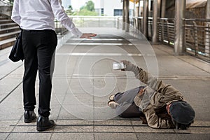 Businessman refuse giving money to homeless man