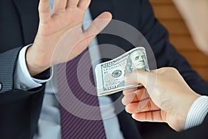 Businessman refusing money, uncorrupted concept