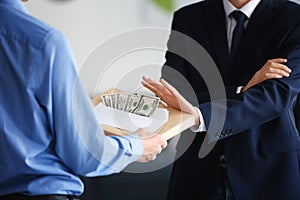 Businessman refusing to take bribe. Corruption concept
