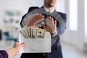 Businessman refusing to take bribe. Corruption concept