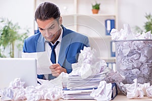 Businessman rejecting new ideas with lots of papers