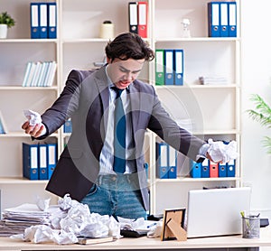 Businessman rejecting new ideas with lots of papers