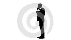 Businessman rejoices in the victory and speaks on the phone. White background. Silhouette