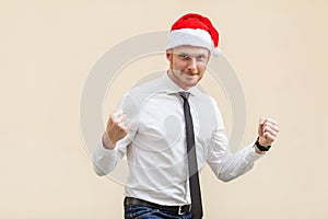 Businessman rejoicing for his success. on light orange background.